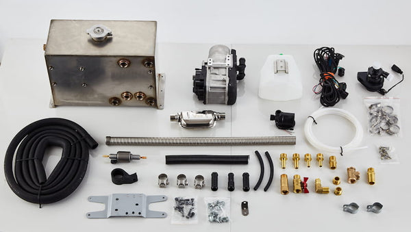 Apollo-GH5 gasoline hot water system complete kit — pre-assembled heater unit, stainless steel tank, fuel pump, wiring harness, exhaust pipe, expansion tank, brass fittings, and mounting hardware